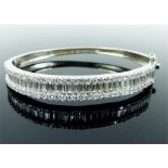 A sterling silver, round and baguette-cut, white crystal bangle