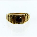 A boxed, Men's 9 ct yellow gold garnet solitaire ring