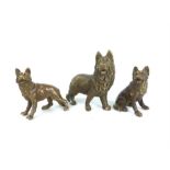 Three Chinese bronze figures of wolves