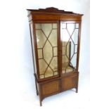 An Edwardian mahogany and line inlaid display cabinet