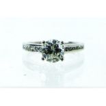 An 18 ct white gold diamond solitaire ring with diamond shoulders (Anchor certificate)