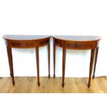 A pair of Sheraton revival mahogany demi-lune side tables