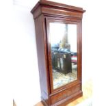 A 19th century French flame mahogany armoire