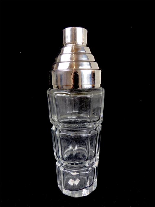 An Art Deco-style, glass, cocktail shaker