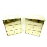 A pair of silver-metal clad, bedside cupboards