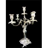 A pair of large heavy cast silver plated five branch candelabras