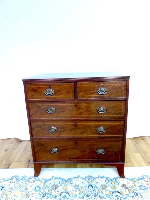 A Regency mahogany and satinwood inlaid chest