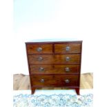 A Regency mahogany and satinwood inlaid chest