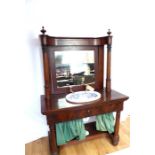 A 19th century flame mahogany Biedermeier wash stand