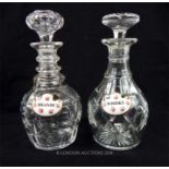 Two cut glass decanters with decanter labels