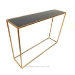 A contemporary metal console table