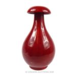 Bernard Moore, (1850 - 1935), A red flambe, bulbous vase