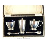 A Three piece Sterling Silver Condiment Set with two spoons (cased).