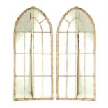 A pair of Gothic style arched garden mirrors