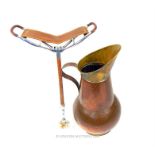 A copper coal scuttle and shooting stick