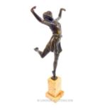 An Art Deco bronze, dancing girl raised on an orange marble base