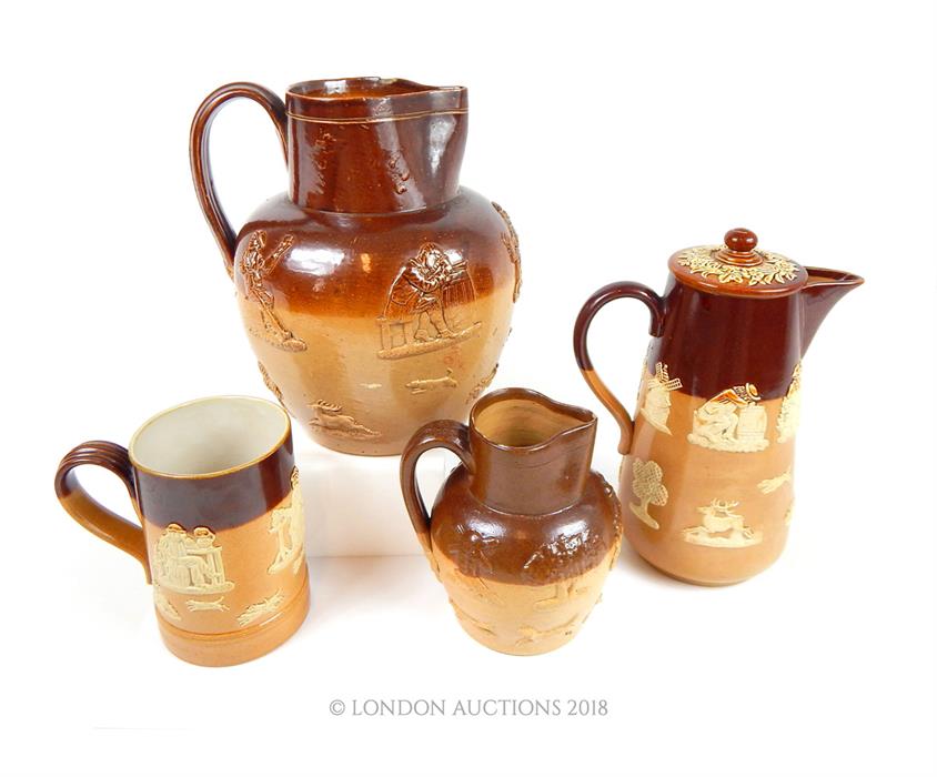 Three late 19th century Doulton stoneware harvest jugs and a similar