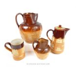 Three late 19th century Doulton stoneware harvest jugs and a similar