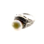 An 18 ct white gold, vintage, diamond and cultured pearl ring