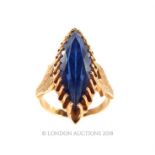 A 15 carat Yellow Gold and Sapphire ring.