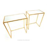 A pair of contemporary mirrored and gilt occasional tables