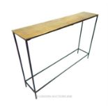 A contemporary console table with a bronzed top