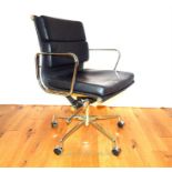 An Eames style office chair in black leather