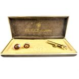 A boxed, Gucci, gilt metal, Gentleman's, cuff-links and tie clip set