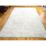 A large vintage white wool Swedish Rya carpet