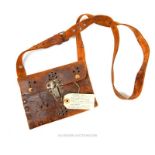 A brown leather Arabic design pouch, film prop from Lawrence of Arabia