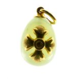 A boxed, designer, 'Lala Ounis' 18 ct yellow gold egg pendant