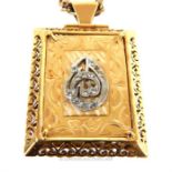 A High Carat Yellow metal locket on 9 carat yellow gold chain .