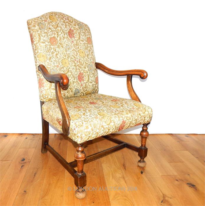 An early 20th century walnut open armchair