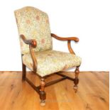 An early 20th century walnut open armchair