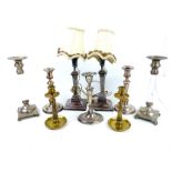 A quantity of silver plated candlesticks.