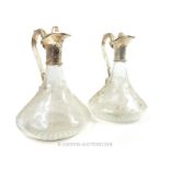 Pair of Vintage Style Glass Water Jugs with metal mounts.