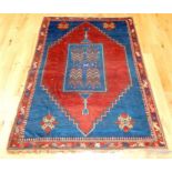 An antique, woollen, Russian Kazak rug (circa 1890)