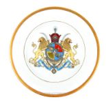 A porcelain plate decorated with the Persian Shah Pahlavi royal coat of arms