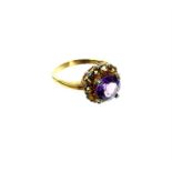 A 9 ct yellow gold, citrine and amethyst dress ring