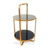 A contemporary circular gilt etagere