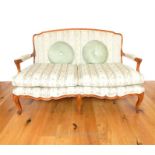 A French, antique-style, twin-seated, upholstered sofa