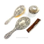 A late Victorian matching sterling silver hand mirror and hair brush