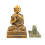 A gilt metal Buddhist seated figure and a seal