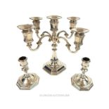 A pair of silver plated candlesticks and a candelabrum