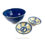 A Chinese blue porcelain bowl and two blue and white bowls