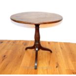 A Georgian oak tilt top table