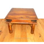 An Indian hardwood low table of square form