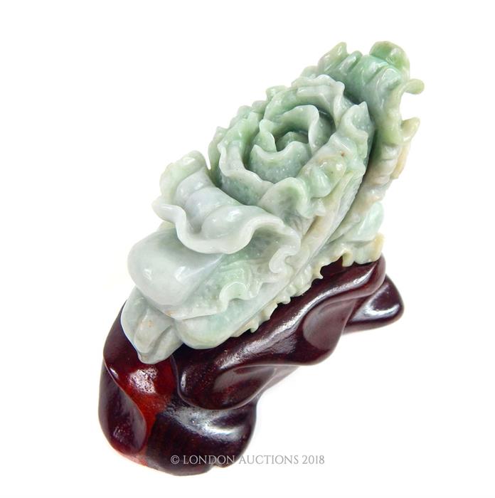 A Chinese jade carving on stand