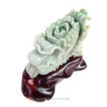 A Chinese jade carving on stand