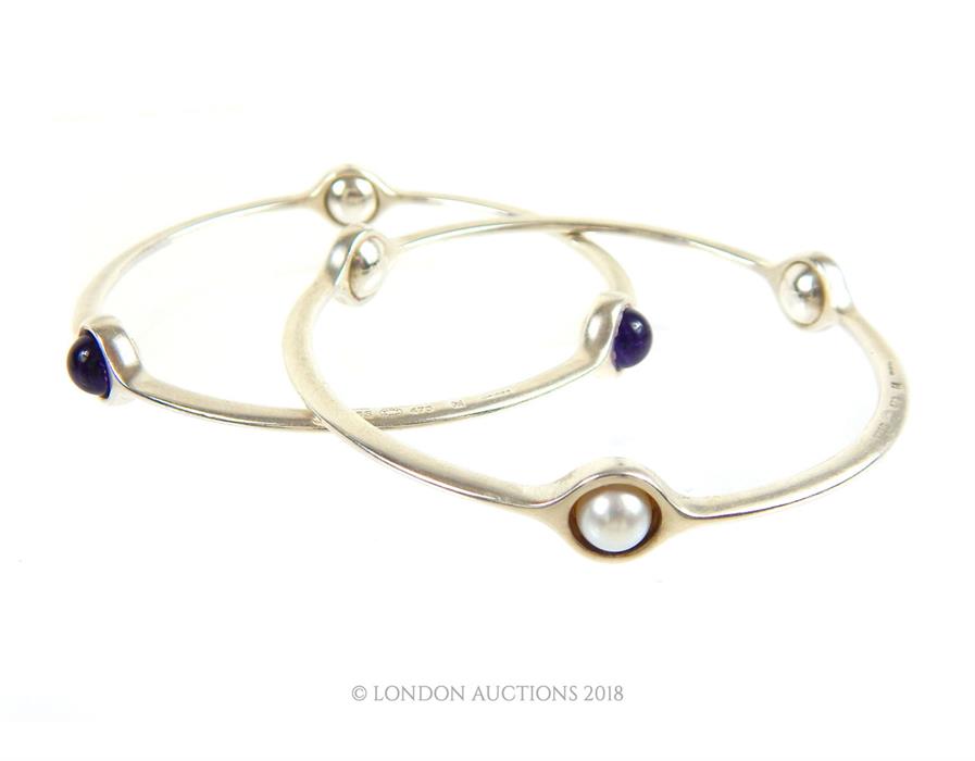 Two Sterling Silver Semi Precious Stone set Bangles. By George Jensen.